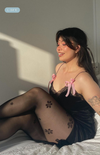 Love Me floral tights paired with black slip dress—romantic and feel-good sheer tights