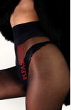 Close-up of 'Please Me' red embroidery on Adore Me sheer tights—playful and sensual statement detail