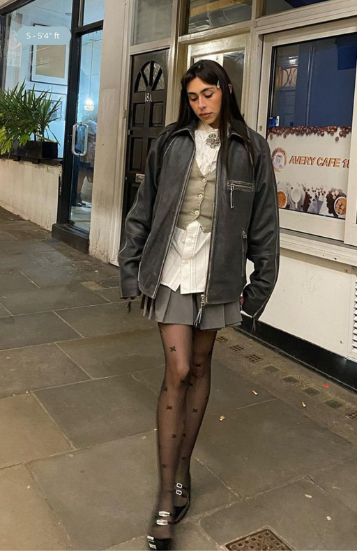 Luxury star-patterned tights for women, worn with a mini skirt