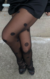 Black dress styled with Be Good polka dot tights—romantic, bold, and made for unforgettable nights