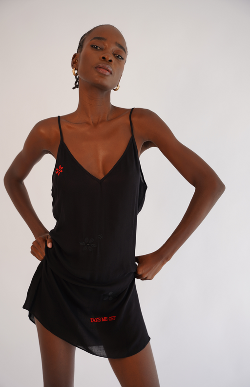 Sheer black lounging dress with floral placement embroidery and red 'Take Me Off' signature